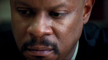 Movie still from “American History X” (1998), directed by Tony Kaye – A man's eyes and face; Extreme Close Up shot, Low angle