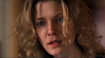 Movie still from “American History X” (1998), directed by Tony Kaye – A woman's face with long blonde hair; Close Up shot, Low angle