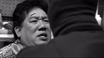 Movie still from “American History X” (1998), directed by Tony Kaye – An older man is looking down at his face; Close Up shot, Over the shoulder angle