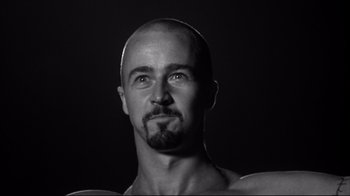 Movie still from “American History X” (1998), directed by Tony Kaye – Black and white photograph of a man with a beard; Close Up shot, Low angle
