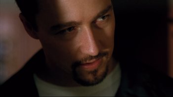 Movie still from “American History X” (1998), directed by Tony Kaye – A man's face in the dark; Close Up shot, Low angle