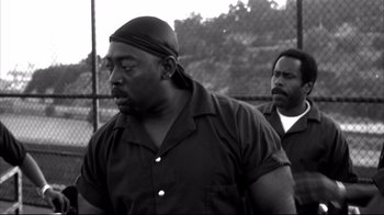 Movie still from “American History X” (1998), directed by Tony Kaye – A black and white photo of two men; Medium shot, Low angle