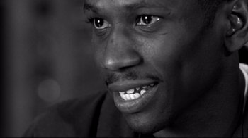 Movie still from “American History X” (1998), directed by Tony Kaye – A man's face in black - and - white; Close Up shot, Low angle