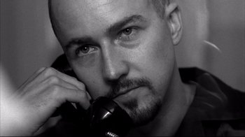 Movie still from “American History X” (1998), directed by Tony Kaye – Black and white photograph of a man on a phone; Close Up shot, Low angle