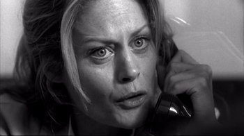 Movie still from “American History X” (1998), directed by Tony Kaye – Black and white photograph of a woman looking at the camera; Close Up shot, Low angle