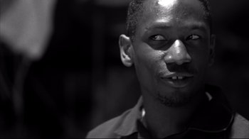 Movie still from “American History X” (1998), directed by Tony Kaye – A black and white photo of a man's face; Close Up shot, Low angle