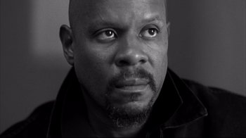 Movie still from “American History X” (1998), directed by Tony Kaye – A black and white photo of a man's face; Close Up shot, Low angle