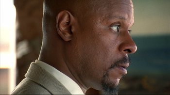 Movie still from “American History X” (1998), directed by Tony Kaye – A man's face looking to his left; Close Up shot, Low angle