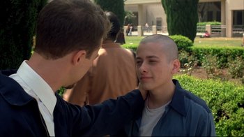 Movie still from “American History X” (1998), directed by Tony Kaye – A young man getting his head shaven by another man; Close Up shot, Over the shoulder angle