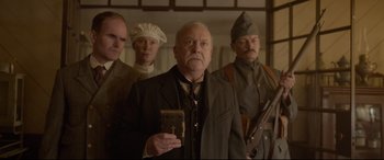 Movie still from “Amsterdam” (2022), directed by David O. Russell – A group of men standing next to each other; Medium shot, Low angle