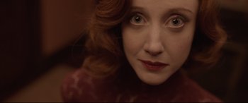 Movie still from “Amsterdam” (2022), directed by David O. Russell – A woman's face with red lipstick; Close Up shot, Over the shoulder angle