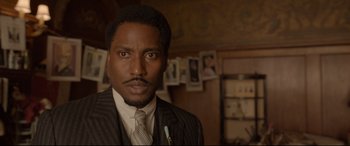 Movie still from “Amsterdam” (2022), directed by David O. Russell – Close Up shot, Over the shoulder angle