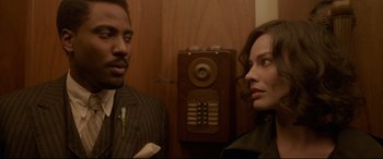 Movie still from “Amsterdam” (2022), directed by David O. Russell – Close Up shot, Over the shoulder angle