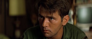 Movie still from “Apocalypse Now” (1979), directed by Francis Ford Coppola – A person with green eyes; Close Up shot, Low angle