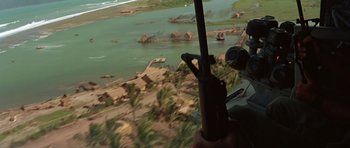 Movie still from “Apocalypse Now” (1979), directed by Francis Ford Coppola – An aerial view of a river and a beach area; Extreme Wide shot, High angle