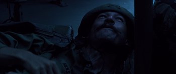 A man wearing a helmet and a camouflage outfit