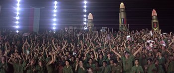 Movie still from “Apocalypse Now” (1979), directed by Francis Ford Coppola – A large group of people in army fatigues; Extreme Wide shot, High angle