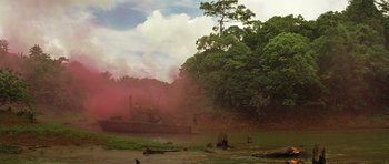 Movie still from “Apocalypse Now” (1979), directed by Francis Ford Coppola – A boat in a body of water near a forest; Extreme Wide shot, High angle