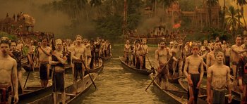 Movie still from “Apocalypse Now” (1979), directed by Francis Ford Coppola – A group of people on canoes on a body of water; Extreme Wide shot, High angle