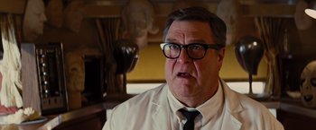 Movie still from “Argo” (2012), directed by Ben Affleck – An older man wearing a white shirt and black tie; Close Up shot, Low angle