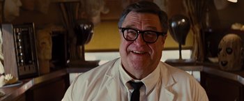 Movie still from “Argo” (2012), directed by Ben Affleck – An older man wearing a white shirt and black tie; Close Up shot, Low angle