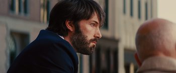 Movie still from “Argo” (2012), directed by Ben Affleck – A person with a beard; Close Up shot, Over the shoulder angle