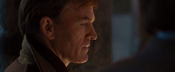 Movie still from “Argo” (2012), directed by Ben Affleck – A man's face in the dark; Close Up shot, Over the shoulder angle