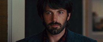 Movie still from “Argo” (2012), directed by Ben Affleck – A person with a beard; Close Up shot, Over the shoulder angle
