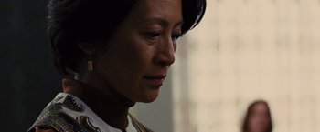 Movie still from “Argo” (2012), directed by Ben Affleck – A person looking down at her face; Close Up shot, Low angle