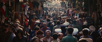Movie still from “Argo” (2012), directed by Ben Affleck – A crowd of people walking down a busy street; Extreme Wide shot, High angle
