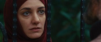 Movie still from “Argo” (2012), directed by Ben Affleck – A person wearing a headscarf; Close Up shot, Over the shoulder angle