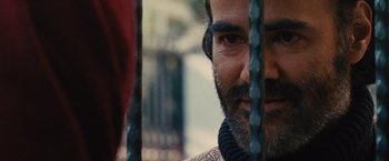 Movie still from “Argo” (2012), directed by Ben Affleck – A person with a beard; Extreme Close Up shot, Over the shoulder angle