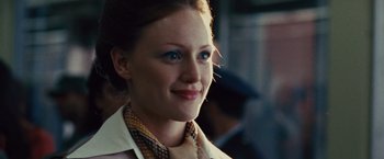 Movie still from “Argo” (2012), directed by Ben Affleck – A person wearing a suit and tie; Close Up shot, Over the shoulder angle