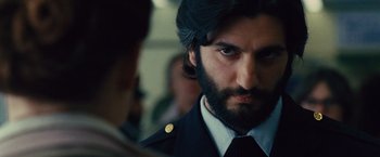 Movie still from “Argo” (2012), directed by Ben Affleck – A person with a beard; Close Up shot, Over the shoulder angle