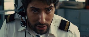Movie still from “Argo” (2012), directed by Ben Affleck – A person wearing a tie; Close Up shot, Low angle