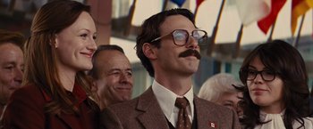 Movie still from “Argo” (2012), directed by Ben Affleck – A man in a suit and tie wearing glasses; Close Up shot, Low angle