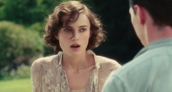 Movie still from “Atonement” (2007), directed by Joe Wright – A beautiful young woman with a short curly hair; Close Up shot, Over the shoulder angle