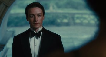 Movie still from “Atonement” (2007), directed by Joe Wright – A man in a tuxedo standing in front of a window; Close Up shot, Over the shoulder angle