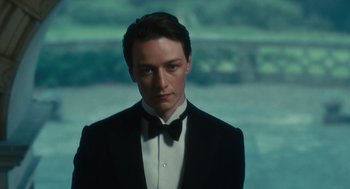 Movie still from “Atonement” (2007), directed by Joe Wright – A man in a tuxedo standing in front of a window; Close Up shot, Low angle