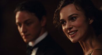 Movie still from “Atonement” (2007), directed by Joe Wright – A man and a woman in a suit and tie; Close Up shot, Over the shoulder angle