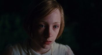 Movie still from “Atonement” (2007), directed by Joe Wright – A young girl is looking into the camera; Close Up shot, High angle