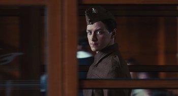Movie still from “Atonement” (2007), directed by Joe Wright – A man in a uniform looking out of a window; Close Up shot, Low angle