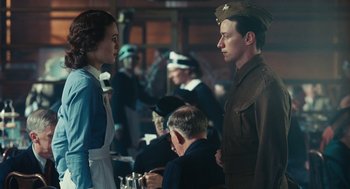 Movie still from “Atonement” (2007), directed by Joe Wright – A man and a woman in uniform standing next to each other; Medium shot, Over the shoulder angle