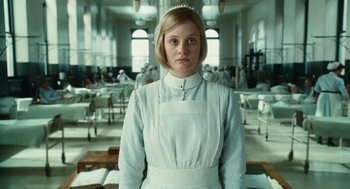 Movie still from “Atonement” (2007), directed by Joe Wright – A woman in a nurse's uniform stands in a room; Close Up shot, Low angle