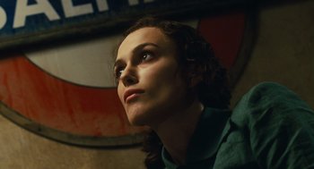 Movie still from “Atonement” (2007), directed by Joe Wright – A person looking to the side; Close Up shot, Low angle