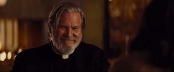 Movie still from “Bad Times at the El Royale” (2018), directed by Drew Goddard – An older man with a long gray beard; Close Up shot, Over the shoulder angle