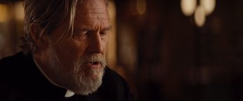 Movie still from “Bad Times at the El Royale” (2018), directed by Drew Goddard – An old man with a beard and a long white beard; Close Up shot, Over the shoulder angle