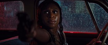 Movie still from “Bad Times at the El Royale” (2018), directed by Drew Goddard – A woman in a car looking out the window; Close Up shot, High angle