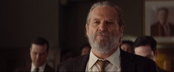 Movie still from “Bad Times at the El Royale” (2018), directed by Drew Goddard – An older man wearing a suit and a tie; Close Up shot, Low angle