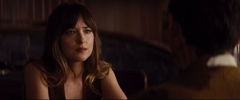 Movie still from “Bad Times at the El Royale” (2018), directed by Drew Goddard – A woman sitting in front of a window; Close Up shot, Over the shoulder angle